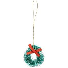 a christmas wreath ornament hanging from a string