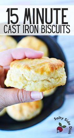 a hand holding a biscuit over a skillet with the words 15 minute cast iron biscuits