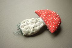 two pieces of fabric with white dots on them, one is red and the other is gray