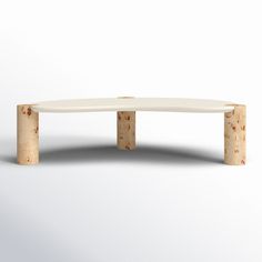 a white table with two wooden legs and a circular top on the bottom, in front of a white background