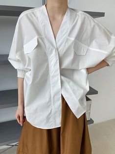 V-neck Workwear Shirt With Pockets, V-neck Shirt With Pockets For Work, White V-neck Top For Spring Workwear, Casual White V-neck Top For Work, Oversized Versatile V-neck Blouse, Versatile Oversized V-neck Blouse, Oversized V-neck Shirt For Summer, White V-neck Chic Shirt, White Casual V-neck Blouse