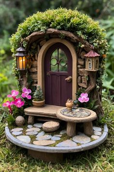 a fairy garden with a table and bench