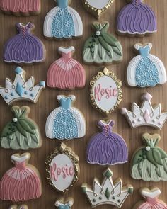 decorated cookies with royal and princess designs on them are arranged in the shape of crowns