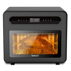 a turkey is cooking in an oven with the door open to show it's roasting process