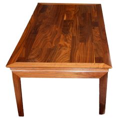 a wooden table sitting on top of a hard wood floor