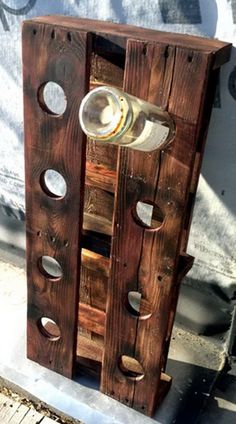 a wine bottle holder made out of wooden pallets