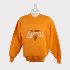 Embroidered Vintage 90s Tennessee Volunteers Sweatshirt Tennessee University Volunteers Football T Shirt Sweater Crewneck Hoodie Jacket Gift 💯 SATISFACTION AND AUTHENTICITY ⭐ MEASUREMENTS (when laid flat) Size on Tag: M Length: 70cm or 27.5 inches Armpit to armpit: 58cm or 23 inches ⭐ CONDITION 9/10 (Very good) Details: No holes Material: Cotton Color: Yellow Brand: Crable Sportswear Vintage Top For Fall Sports Events, Vintage Tops For Fall Sports Events, Vintage Tops For Sports Events In Fall, Retro Crew Neck Hoodie For Fall, Vintage Crew Hoodie For Winter, Throwback Fleece Sweatshirt For Fall, Vintage Crew Neck Winter Hoodie, Vintage Winter Crew Hoodie, Vintage Fleece Tops For Streetwear