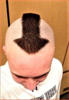 a man with a balding head has his hair cut into the shape of an arrow