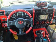 the interior of a car with steering wheel and dashboard