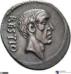 an ancient roman coin with a man's head in profile and the words on it