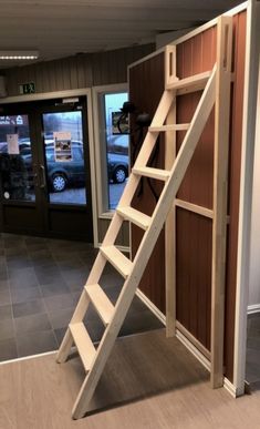 a ladder is attached to the side of a door