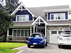 two cars parked in front of a house