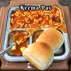 there is a tray with some food on it and the words keema pav