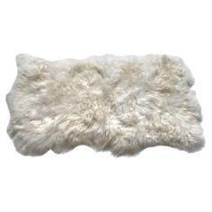 a white sheepskin rug on a white background