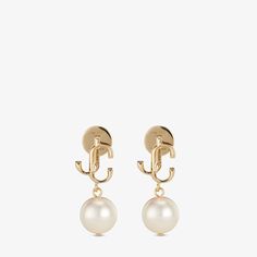 The JC Pearl Studs combine elegance with modernity. Italian-crafted in gold-finish metal, the pearl earrings are decorated with the signature JC monogram for an unmistakable Jimmy Choo touch. The earrings can be styled with the JC Pearl ring for a timeless and sophisticated look.