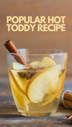 a glass cup filled with apple cider and cinnamon