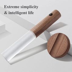 an image of a knife and wooden handle on a white surface with the words extreme simplity & intelligent life