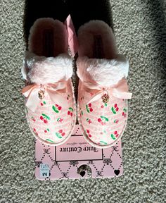 a pair of pink shoes with flowers on them