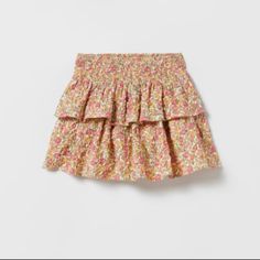 Skirt With Elastic Waistband. Smocked Detail And Ruffles. Playful Ruffled Skirt For Spring, Playful Pink Bloomers With Elastic Waistband, Pink Skirt With Smocked Bodice For Summer, Elastic Waistband Skirt For Spring, Pink Skirt With Smocked Back For Summer, Playful Skirted Bottoms With Elastic Waistband, Cute Tiered Skirt With Elastic Waistband, Zara Gathered Skirt For Spring, Pink Smocked Dress With Tiered Skirt