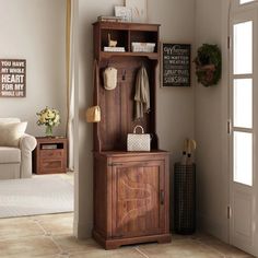 a wooden cabinet sitting in the corner of a living room