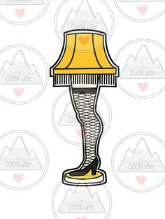 a lamp that is sitting on top of a table with a yellow shade over it