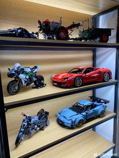 toy cars and motorcycles are displayed on shelves