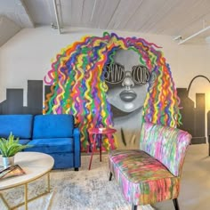 a living room filled with colorful furniture and art