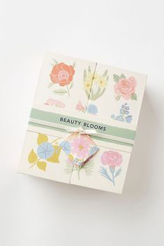 an open box with flowers on it