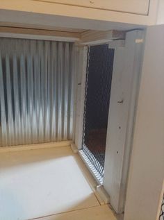 the inside of a microwave oven with its door open and some metal coverings on it