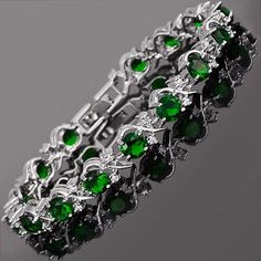 Beautiful Round Cut Green Emerald And Clear Cubic Zirconia With 18k White Gold Plated Tennis Bracelet. These Bracelets Are Gorgeous And Very Nice Quality. They Have A Nice Weight To Them, Are Incredibly Sparkly, And You Will Get Compliments Every Time You Wear It. Bracelet Size Is 6mm X 180mm And Stone Size 5mm X 7mm X 15. Happy Shopping! Green Gemstone Bracelet, Blossom Bracelet, Bracelet Box, Red Bracelets, Gold Plated Bracelets, Green Gemstones, Green Emerald, Online Jewelry Store, Tennis Bracelet