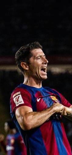 a soccer player with his mouth wide open