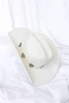 Details White cowgirl hat Silver heart details Brim measures 3.5 inches White Cowgirl Hat, Cowgirl Hat, Cowgirl Hats, Silver Heart, Hats, Silver, White