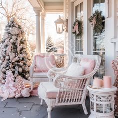 a porch decorated for christmas with pink and white furniture