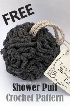 a crocheted ball of yarn with a tag on it that says, shower puff crochet pattern