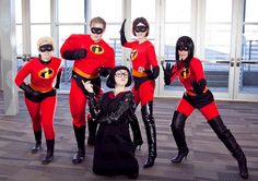 a group of people in costumes posing for a photo