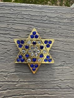 Star of David Brooch Pin Color: Blue and Gold  New with velvet pouch  2" size  Perfect addition to your everyday outfit, or for Religious Holidays. Makes a great gift for yourself, or a Host. Also great gift for holidays/ Passover, Hanukkah, Bat Mitzvah, Bar Mitzvah, etc!  Check out my other items for sale. I offer flat shipping on entire purchase. Jewish Star, Velvet Pouch, Menorah, Gold Rhinestone, New Jewelry, Everyday Outfit, Star Of David, Rhinestone Brooches, Bar Mitzvah