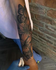 a person with a tattoo on their arm