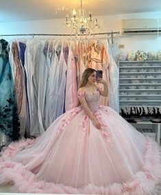 Step into your fairytale moment with this enchanting pink off-the-shoulder Quinceanera ball gown. This dress is crafted from luxurious tulle fabric, offering volume and elegance in every movement. The soft pink hue adds a touch of youthful charm, perfect for celebrating your special day. The off-the-shoulder neckline gracefully frames the shoulders, while intricate appliqued embellishments enhance its romantic appeal. A sweeping train adds a regal finish, making every step memorable. The lace-up Vestidos Color Fucsia, Pink Sweet 16 Dress, Princess Quinceanera Dresses, Xv Ideas, Women Celebrating, Pink Sweet 16, Dresses Off Shoulder, Pink Ball Gown, Vestidos Color Rosa