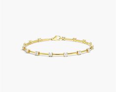 14K Yellow Gold Lab-Grown Diamond Station Dash Bracelet. Just a hint of subtle sparkle, this fashion bracelet suits her feminine yet bold style. Crafted in 14K gold, this clever design pairs gracefully polished bar links with lab-created diamond stations in a look that captures the eye. This modern bracelet secures with a pear shaped lobster clasp. Modern Bracelet, Real Diamond Necklace, Modern Bracelets, Bold Style, Clever Design, Diamond Bracelets, Lab Created Diamonds, Real Diamonds, Bold Fashion