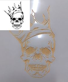 a skull with a crown on it's head is shown next to a sticker