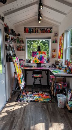 an artist's studio with lots of art supplies