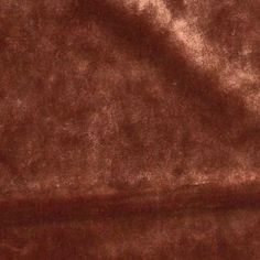 a close up view of a brown velvet material