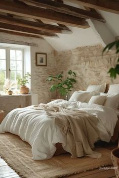 a bed sitting in a bedroom next to a window with a potted plant on top of it