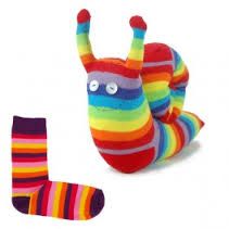 a multicolored striped stuffed animal laying on its side