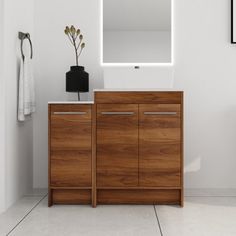 a bathroom with a sink, mirror and wooden cabinet