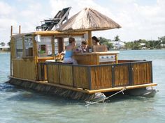 a small house boat floating on top of the water