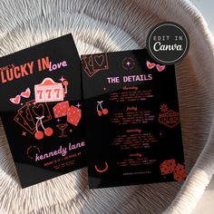 two black and pink wedding cards on a white plate with the words lucky in love