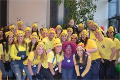 a group of people in costumes posing for a photo