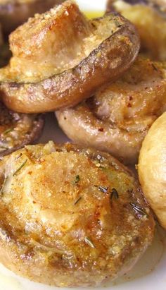 cooked mushrooms on a plate with garlic and pepper