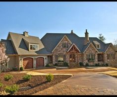 a large house in the middle of a wooded area